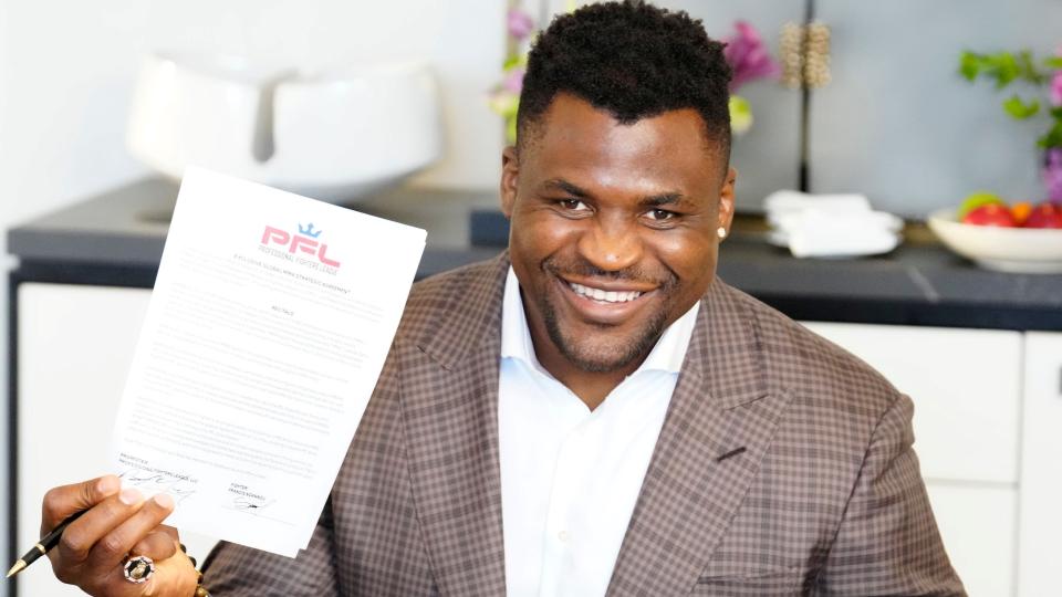 Francis Ngannou holding his PFL contract